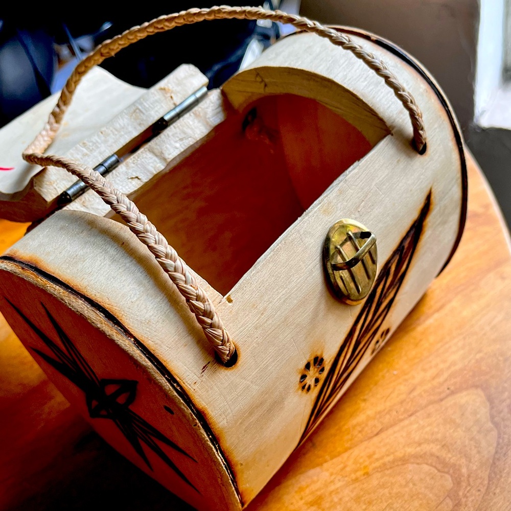 Cute small wooden antique purse to store items in.